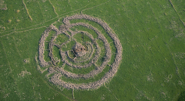 Rujm el-Hiri is an ancient megalithic monument, consisting of concentric circles of stone with a tumulus at center. It is located in the Golan Heights, some 16 kilometres east of the eastern coast of the Sea of Galilee. The picture shows an aerial view of the archeological site. Photo by Itamar Grinberg.